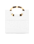 Back of a white ostrich textured handbag on a white background