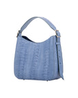 Side of a blue textured handbag on a white background