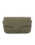 Front of a forest green ostrich textured handbag on a white background