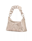 The side of a gold shimmer python textured handbag on a white background
