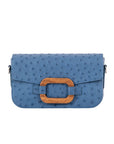 Front of a blue ostrich textured handbag on a white background