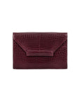 Front of a maroon crocodile textured clutch bag on a white background