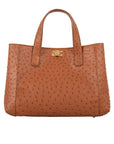 Cognac ostrich-patterned handbag with a shoulder strap on a white background