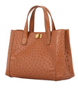 Cognac ostrich-patterned handbag with a shoulder strap on a white background