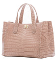 Side of a walnut crocodile textured handbag on a white background