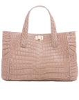 Front of a walnut crocodile textured handbag on a white background