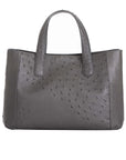 Back of an anthracite ostrich textured handbag on a white background