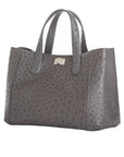 Side of an anthracite ostrich textured handbag on a white background