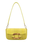 Front of a woven handbag with a strap on a white background
