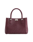 Maroon handbag with a silver clasp on a white background