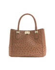 Brown textured handbag with gold accents on a white background