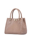 Beige handbag with crocodile texture on a white background