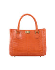 Orange crocodile-patterned handbag on a white background