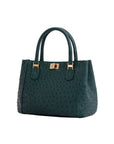 Green handbag with gold accents on a white background