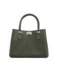 Green textured handbag with gold hardware on a white background