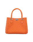 Orange textured handbag on a white background