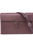 Ostrich textured briefcase with a silver clasp and strap on a white background