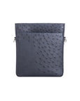 Navy ostrich leather crossbody bag with zipper on a white background