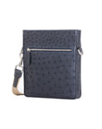 Navy ostrich leather crossbody bag with zipper on a white background
