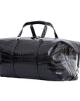 Large black crocodile bag with straps on a white background