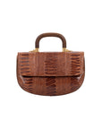 Front of cognac handbag with a wooden handle on a white background