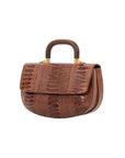 Side of cognac handbag with a wooden handle on a white background