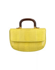 Front of a yellow ostrich leg handbag with a wooden handle on a white background