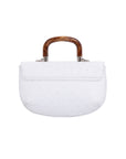 Back of a white ostrich handbag with a wooden handle on a white background