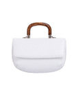 Front of a white ostrich handbag with a wooden handle on a white background