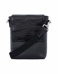 Black crocodile textured messenger bag with strap on a white background