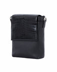 Black crocodile textured messenger bag on a white background