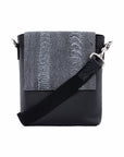 Black messenger bag with dark grey ostrich material on a white background