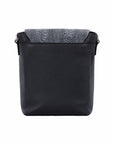 Back view of black messenger bag with dark grey ostrich material on a white background