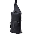 Side of a black python textured chest bag on a white background