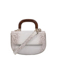 White crocodile-textured handbag with wooden handle on a white background