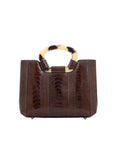 Front of brown handbag with a handle on a white background