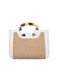 Front of a woven handbag with a white ostrich outline on a white background