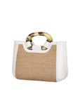 Side of a woven handbag with a white ostrich outline on a white background