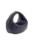 Navy blue handbag with crocodile texture on a white background