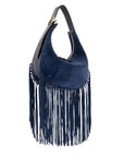 Navy blue suede handbag with fringe details on a white background