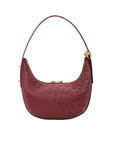 Maroon ostrich-textured handbag with gold zipper on a white background