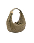 Green ostrich-handbag with a gold clasp on a white background