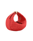 Red ostrich-textured handbag with gold zipper on a white background