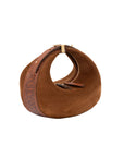 Brown suede handbag with a strap on a white background