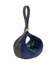 Blue suede handbag with gold accents on a white background