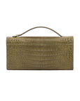 Back of crocodile forest green textured clutch bag on a white background