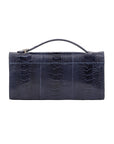Back side of navy ostrich textured handbag on a white background