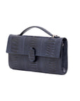 Side of navy ostrich textured handbag on a white background