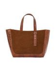Brown semi suede-textured handbag on a white background