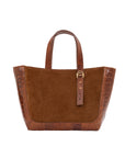 Brown semi suede-textured handbag on a white background